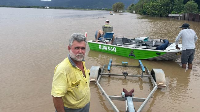 Wayne Featonby, from Banksia Close in Holloways Beach, with his boat.