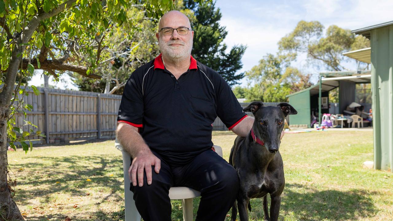 Brett Terry with his greyhound Buddy at his home in Hampton Park. Picture: Jason Edwards