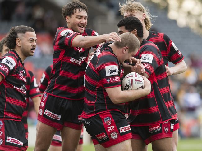 Valleys players celebrate a try by Kael Tremain (centre). Picture: Kevin Farmer.