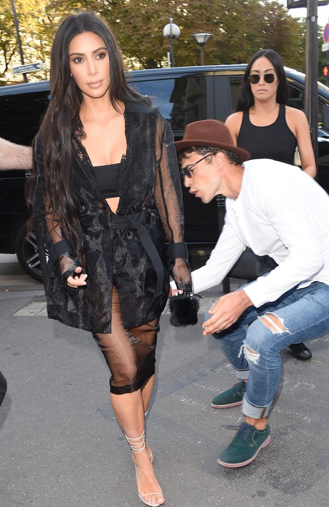 Celebrity pranker Vitalii Sediuk strikes again, grabbing Kim Kardashian at L’Avenue restaurant on September 28, 2016 in Paris. Picture: Splash