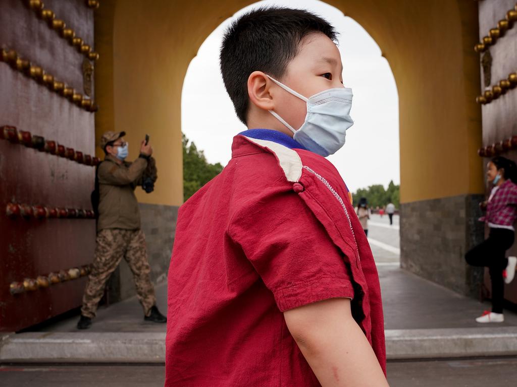A boy in Beijing where life is slowly returning to normal. Picture: Getty