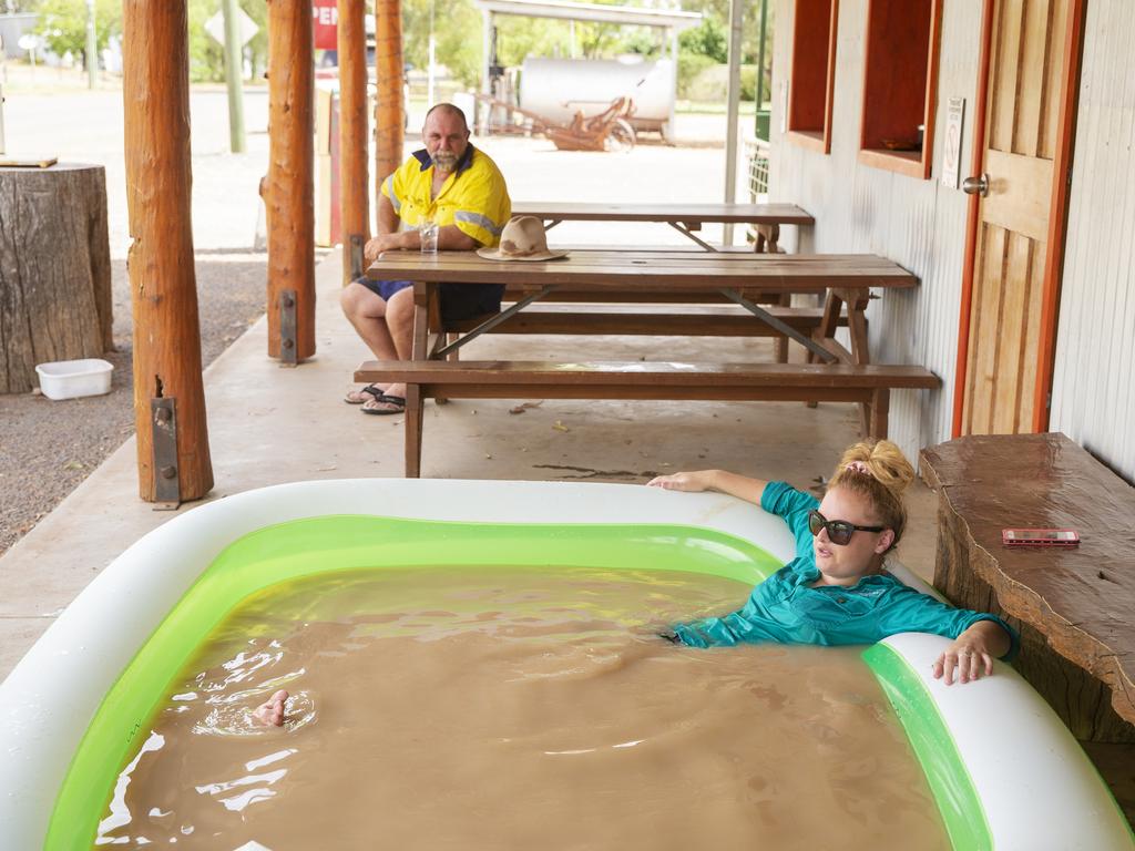 Jasmin Kew relaxes in a blow up pool full of muddy tap water from the Darling River in 47 degree heat outside of Shindy's Inn on January 17, 2019 in Louth, Australia. Local communities in the Darling River area are facing drought and clean water shortages as debate grows over the alleged mismanagement of the Murray-Darling Basin. Recent mass kills of hundreds of thousands of fish in the Darling river have raised serious questions about the way WaterNSW is managing the lakes system, and calls for a royal commission. (Photo by Jenny Evans/Getty Images)