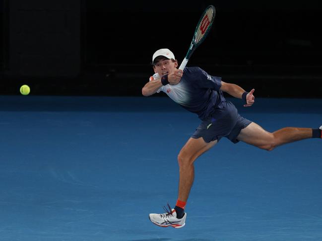 Australia's Alex de Minaur hits a return against Alex Michelsen. Picture: Adrian Dennis/AFP.