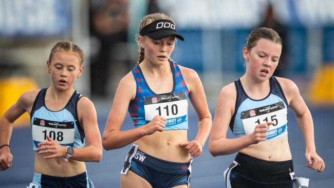 Maisie Mitchell (12) from Mount Bowen, NSW, takes out the Australian title. Maisie is flanked by Jessica Loring from Northmead and Matilda Webb from Winston Hills.