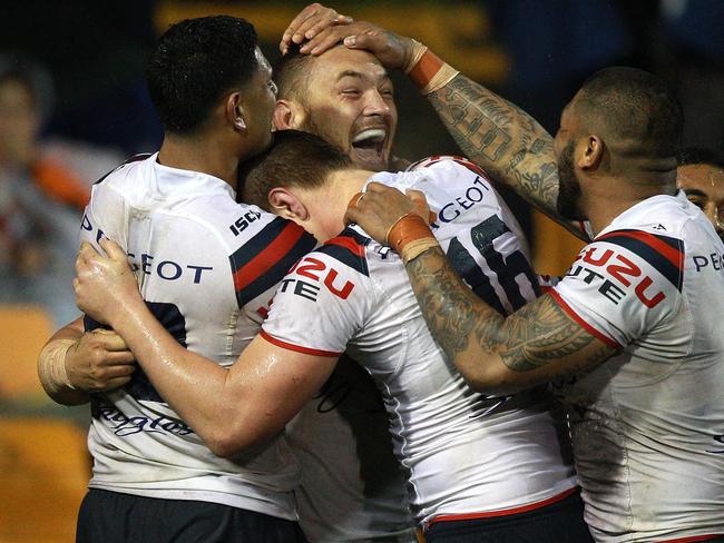 SYDNEY, AUSTRALIA - AUGUST 16: Jared Waerea-Hargreaves of the Roosters celebrates scoring a try during the round 23 NRL match between the Wests Tigers and the Sydney Roosters at Leichhardt Oval on August 16, 2014 in Sydney, Australia. (Photo by Matt Blyth/Getty Images)