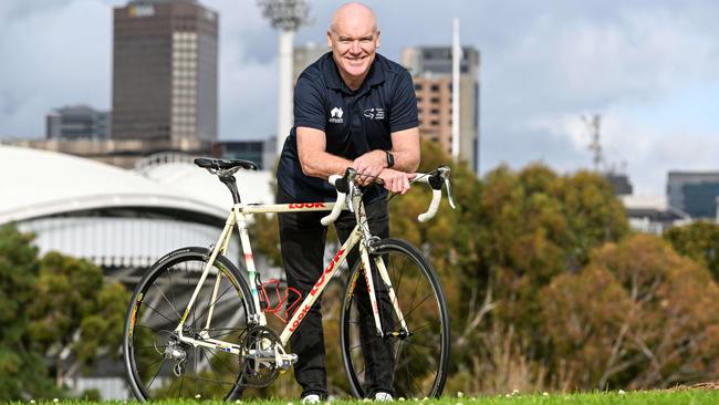 TDU race director Stuart O'Grady at Montefiore Hill with the bike he rode to win the 1999 race. Picture: Brenton Edwards