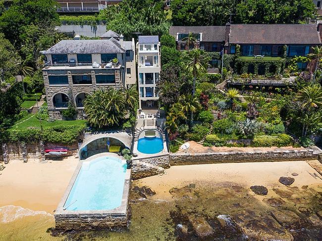 The four-level, four-bedroom, three-bathroom home occupies 207sq m with a 6m sandy beach.