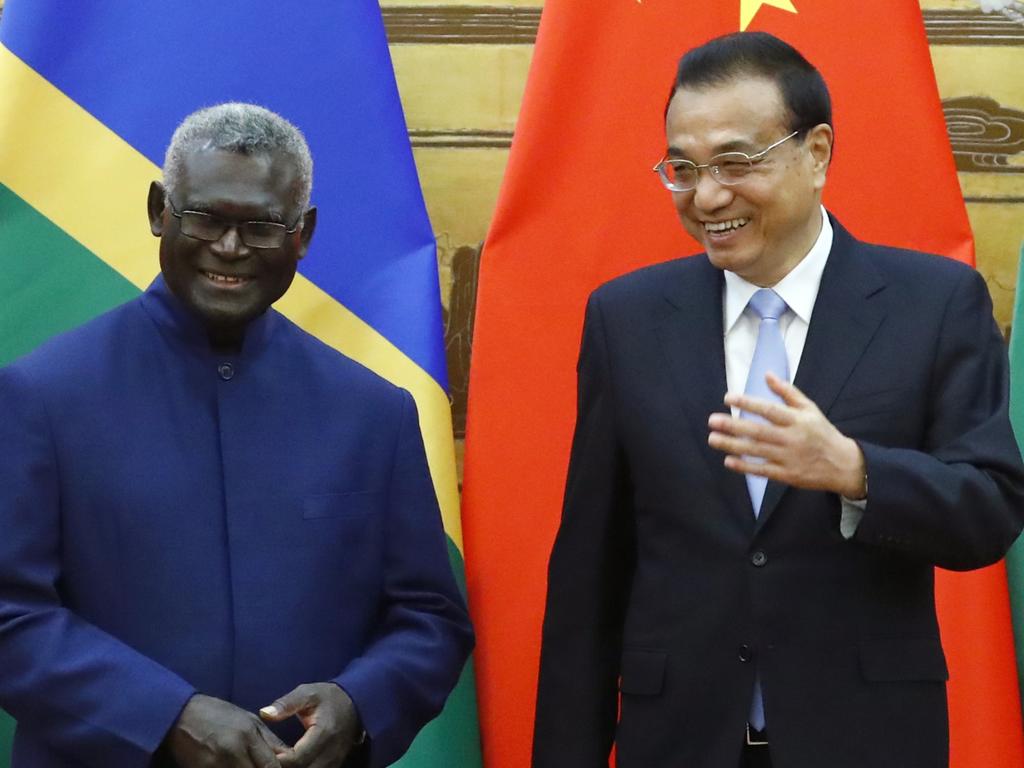 Solomon Islands Prime Minister Manasseh Sogavare and Chinese Premier Li Keqiang attend a signing ceremony at the Great Hall of the People on October 9, 2019 in Beijing, China. Picture: Thomas Peter-Pool/Getty Images