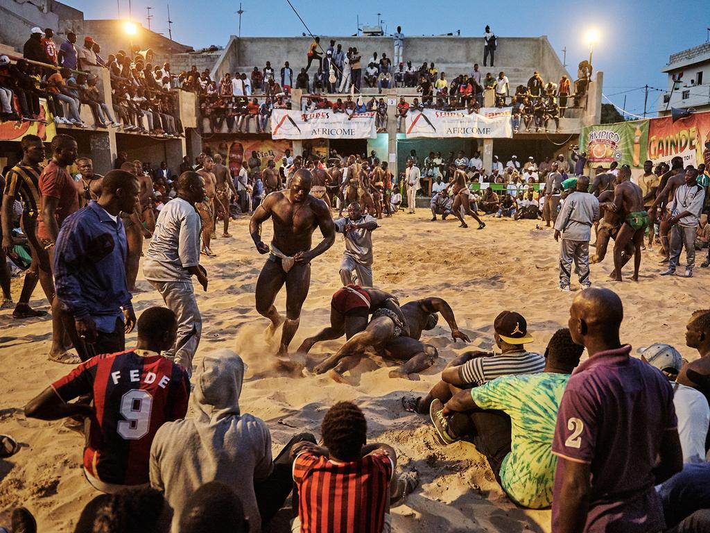“The Gris-gris Wrestlers of Senegal” by photographer Christian Bobst which won the second prize Sports Stories category shows a tournament in the Adrien Senghor arena leaning towards the end. The wrestling fights take place in the late evenings when temperatures drop. Dakar, Senegal, 28 March 28, 2015. (Christian Bobst, World Press Photo via AP)