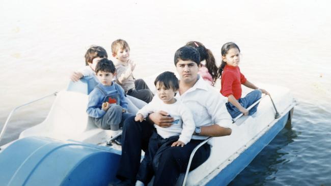 Jabra Tarazi as a child (middle on his uncle’s lap) in Gaza with extended family members. Picture: Sam Ruttyn