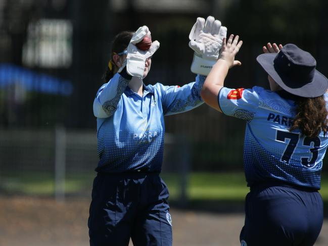 Wicketkeeper Lucy Culnane celebrates a wicket with Zara Floody. Picture Warren Gannon Photography