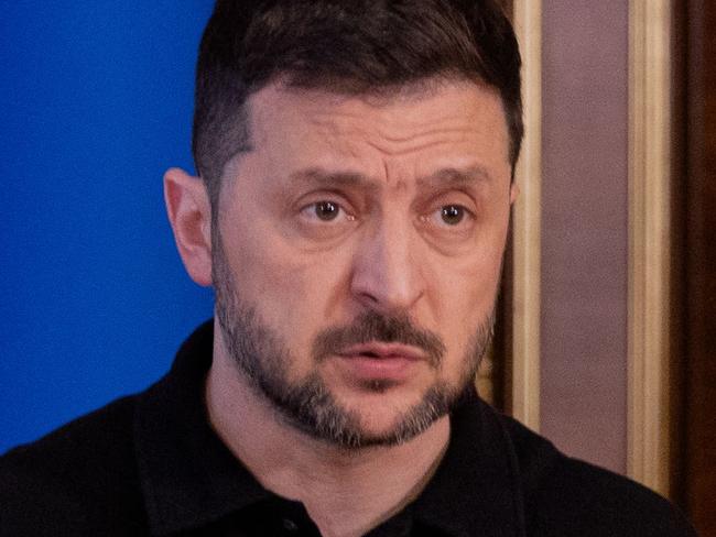 Ukraine's President Volodymyr Zelensky gestures as he speaks during a press conference in Kyiv on April 17, 2025, amid the Russian invasion of Ukraine. (Photo by Tetiana DZHAFAROVA / AFP)