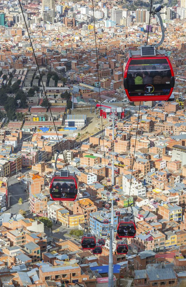 Cable cars carry passengers between the cities of El Alto and La Paz in Bolivia.