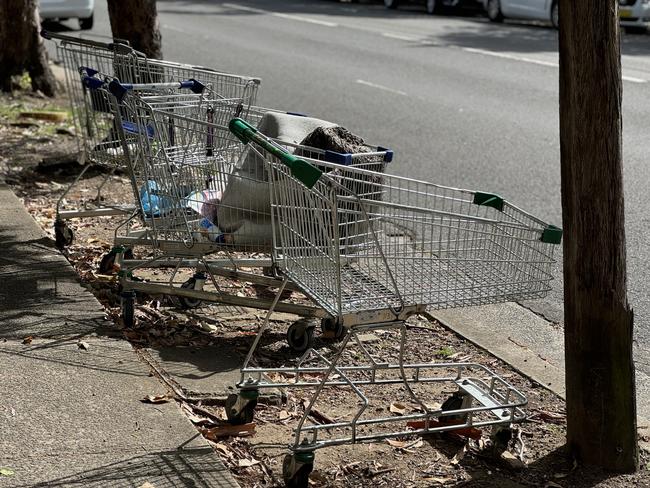 Abandoned shopping trolleys filled with rubbish on Meredith St, Bankstown, on Tuesday. Picture: Canterbury-Bankstown Express