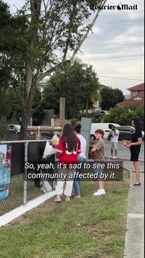 Locals pay tribute and speak at the scene of the Murrumba Downs accident