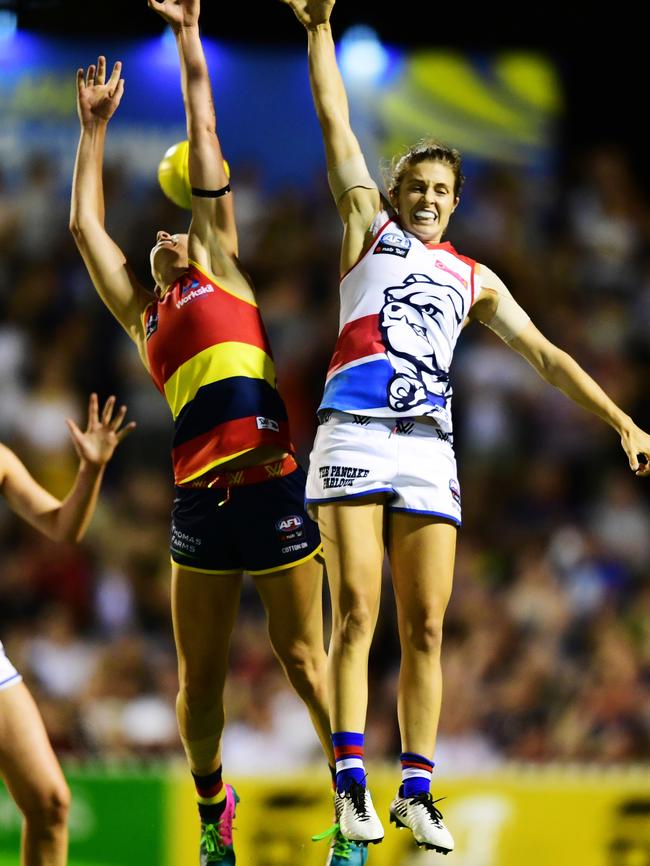 Crows Deni Varnhagen is at full stretch against the Western Bulldogs Ellie Blackburn during Adelaide’s one-point loss in Round 1 of AFLW in Adelaide on Saturday, February 2, 2019. Picture: AAP Image/Mark Brake