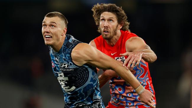 Tom Hickey (right) is pushing to return for Sydney’s clash with Melbourne ruck duo Max Gawn and Luke Jackson. Picture: Getty Images