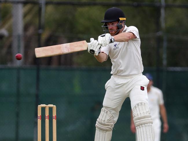 Justin Galeotti sends a cut shot to the boundary for Essendon. 