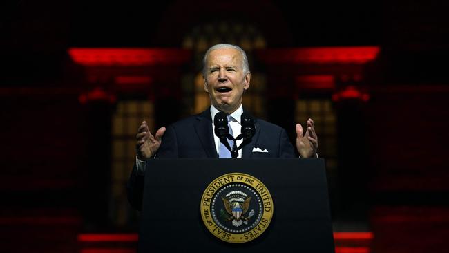 Joe Biden decries Trump’s MAGA forces outside Independence Hall, which was drenched in ominous red lighting for the occasion. Picture: Jim Watson/AFP