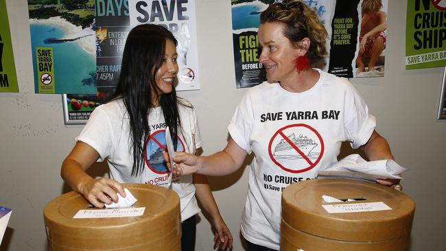 Local volunteers Leanna Ooi and Andrea Laracy man the letter submission barrels. Picture: John Appleyard