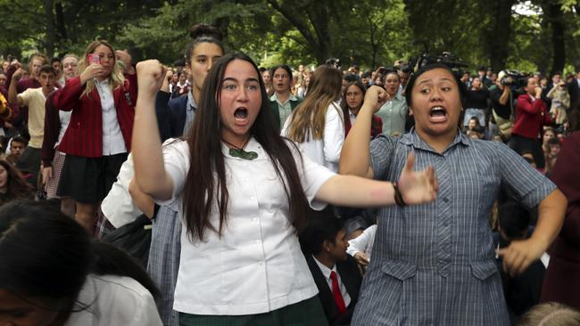 Students perform the haka during a vigil to commemorate victims of Friday's shooting, outside the Al Noor mosque. Picture:  Vincent Thian/AP