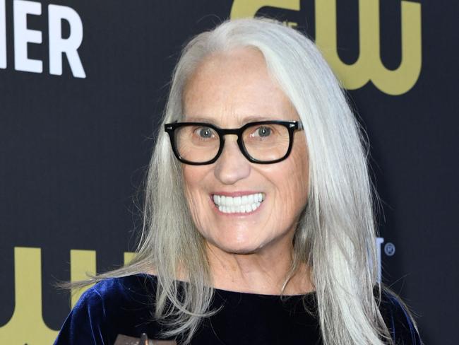 New Zealand director Jane Campion poses in the press room with the award for Best Director for 