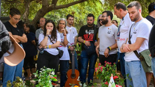 Friends, family and residents visit the graves for people killed on the first anniversary since Hamas attacked one year ago on October 7 at Kibbutz Nir Oz, Israel. Picture: Getty Images