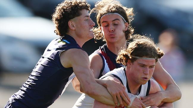 MELBOURNE, AUSTRALIA - SEPTEMBER 17: Patrick Hughes of the Geelong Falcons is tackled during the Coates Talent League Boys Preliminary Final match between Sandringham Dragons and Geelong Falcons at Queen Elizabeth Oval on September 17, 2023 in Melbourne, Australia. (Photo by Graham Denholm/AFL Photos via Getty Images)