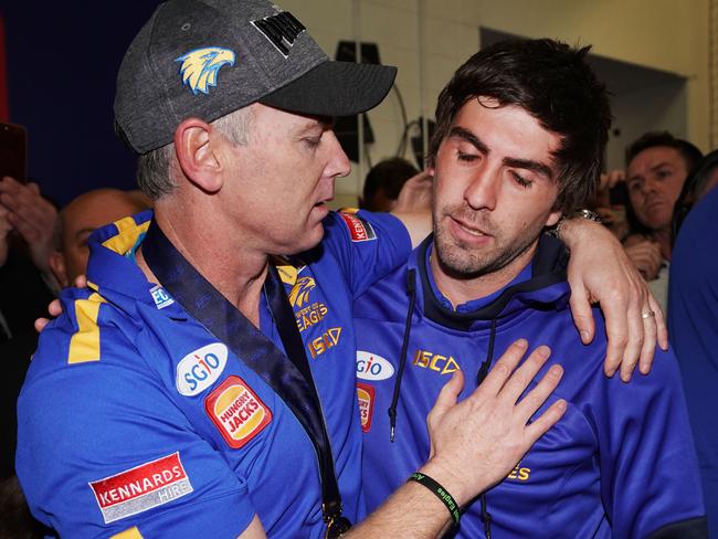 Eagles coach Adam Simpson consoles suspended star Andrew Gaff after the Grand Final.