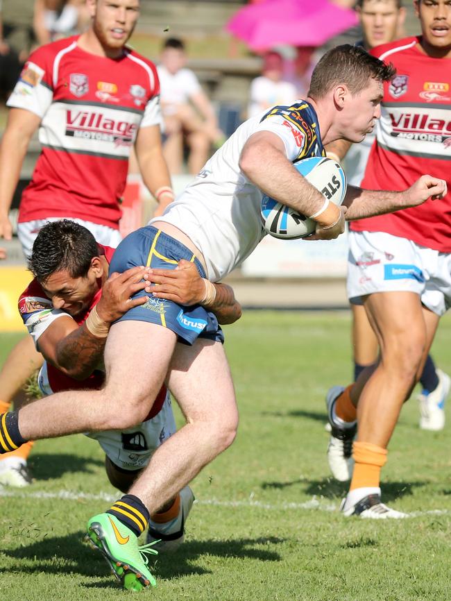 Intrust Super Cup Redcliffe Dolphins Shane Pumipi tackles Norths Devils John Mackin - Picture: Richard Walker