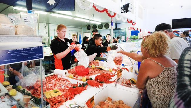 Tasman Star Seafoods at Varsity are swamped by Christmas shoppers at their store after being told to expect good prices on crayfish etc for their Christmas lunch. Photo: Scott Powick Newscorp