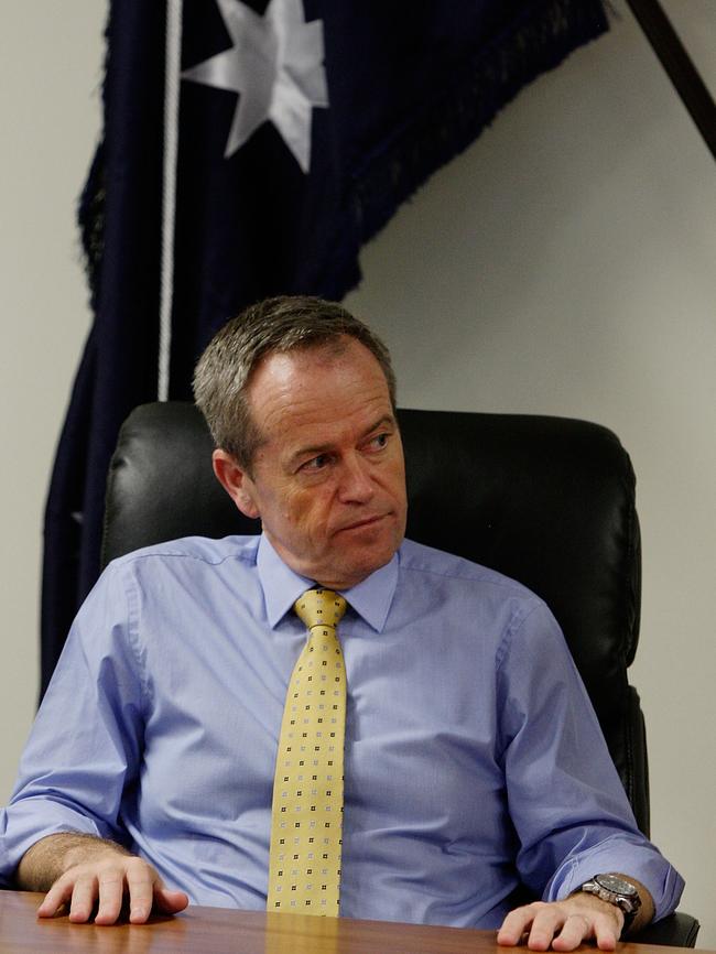 Bill Shorten sits for a briefing during a tour of the Royal Australian Air Force Base. Picture: Lisa Maree Williams/Getty Images