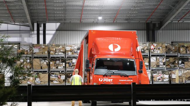 A busy Australia Post distribution centre, with parcels destined for housebound consumers. Picture: Picture: Steve Tyson