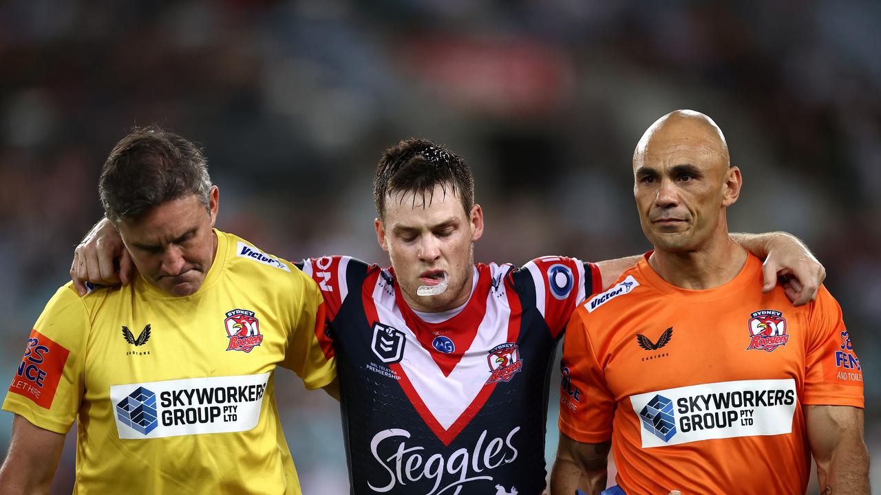 SYDNEY, AUSTRALIA – MARCH 26: Luke Keary of the Roosters is helped off the field after a leg injury during the round three NRL match between the South Sydney Rabbitohs and the Sydney Roosters at Stadium Australia on March 26, 2021, in Sydney, Australia. (Photo by Cameron Spencer/Getty Images)