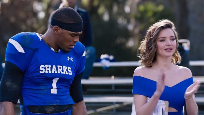 Miranda Kerr, pictured with Cam Newton, has one line in the ad. Picture: Buick