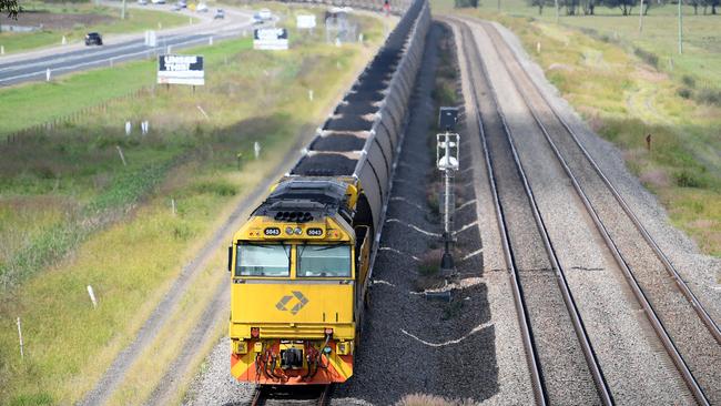 About 12 coal trains a day will pass Algester, Parkinson and Acacia Ridge homes as part of the Inland Rail realignment. Photo: AAP/Dan Himbrechts