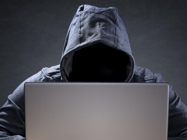 Computer hacker stealing data from a laptop concept for network security, identity theft and computer crime. Picture: iStock.