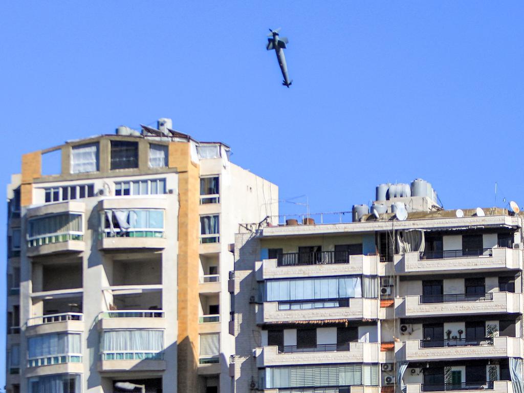 Tense situation: A rocket fired by an Israeli war plane approaches a building in Beirut’s southern suburb of Shayah on October 22, 2024, amid the ongoing war between Israel and Hezbollah. Picture: AFP