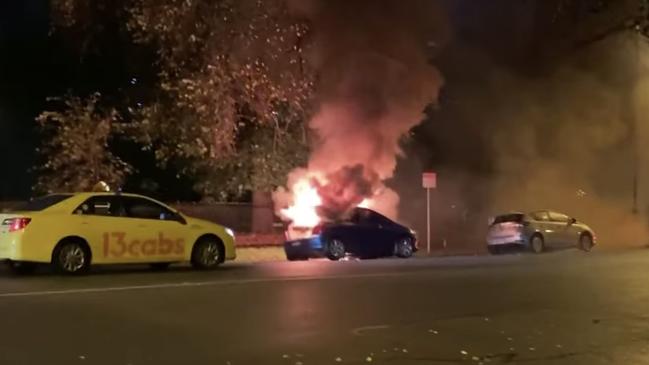 A South Melbourne resident has captured shocking footage of a car going up in flames filling Park St with smoke. Source: Facebook