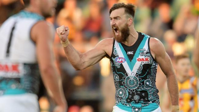 Charlie Dixon celebrates his goal against Hawthorn.