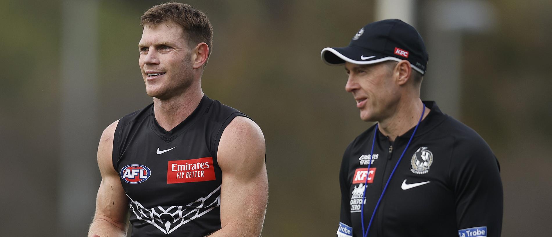 MELBOURNE, AUSTRALIA - SEPTEMBER 20: Taylor Adams of the Magpies (L) chats with Magpies head coach Craig McRae embrace during a Collingwood Magpies AFL training session at Olympic Park Oval on September 20, 2023 in Melbourne, Australia. (Photo by Daniel Pockett/Getty Images)
