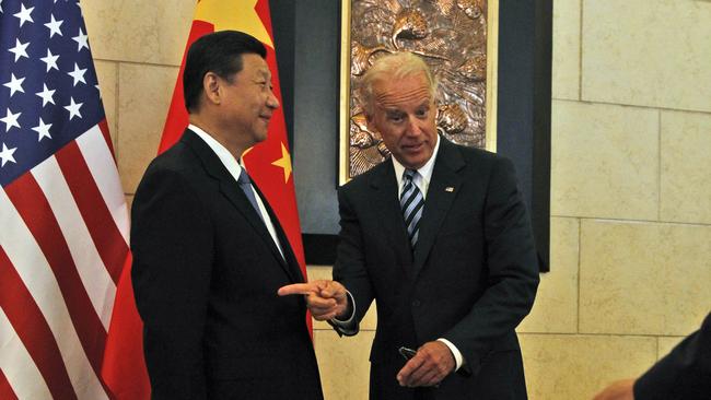 Joe Biden meets Xi Jinping at a Beijing hotel in 2011, when both men were vice-presidents. Picture: AP