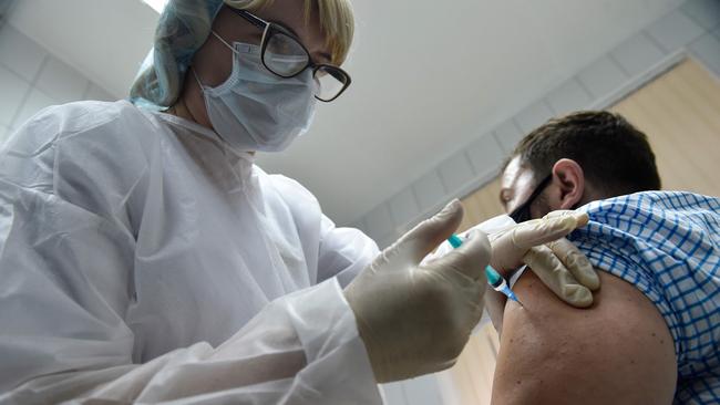 A nurse inoculates volunteer Ilya Dubrovin, 36, with Russia’s new coronavirus vaccine, Sputnik V, in September. Picture: AFP