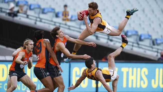 MELBOURNE, AUSTRALIA – JUNE 27: Tim O'Brien of the Hawks takes a spectacular mark during the round 15 AFL match between the Greater Western Sydney Giants and the Hawthorn Hawks at Melbourne Cricket Ground on June 27, 2021 in Melbourne, Australia. (Photo by Daniel Pockett/Getty Images)