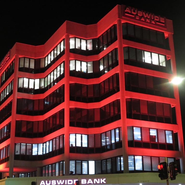 The Auswide building has been changing colours.