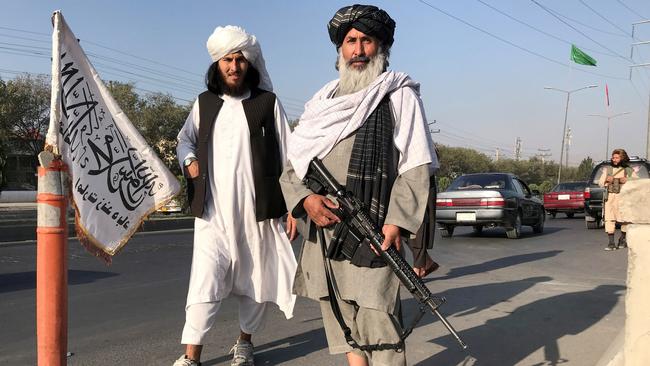 A Taliban fighter holding an M16 assault rifle stands outside the Interior Ministry in Kabul, Afghanistan. Picture: Reuters