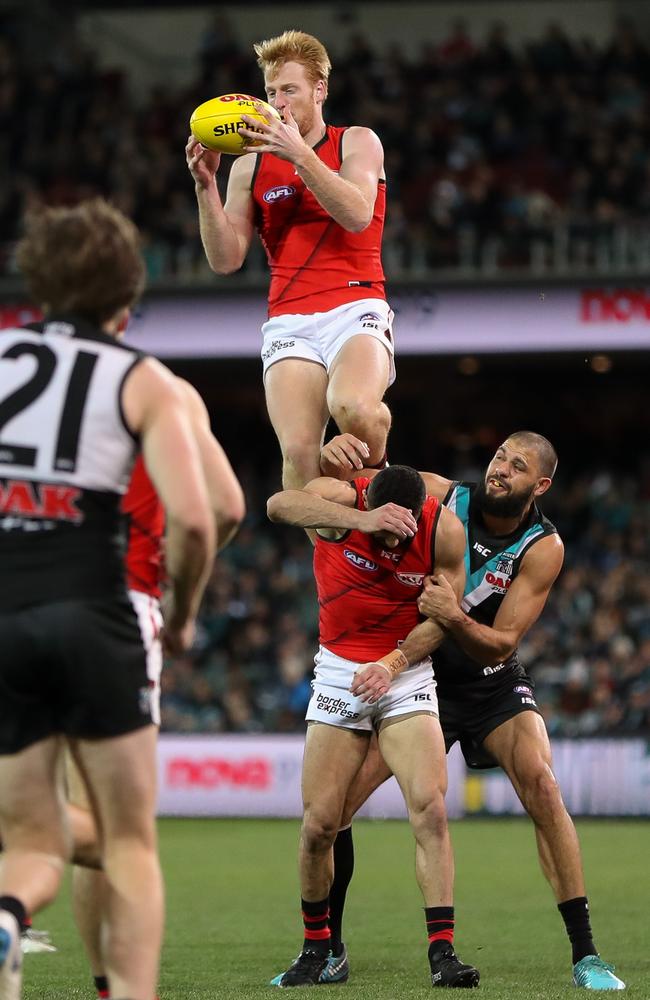 Aaron Francis of the Bombers takes a huge mark over teammate Adam Saad and Paddy Ryder of the Power. Picture: AFL Media