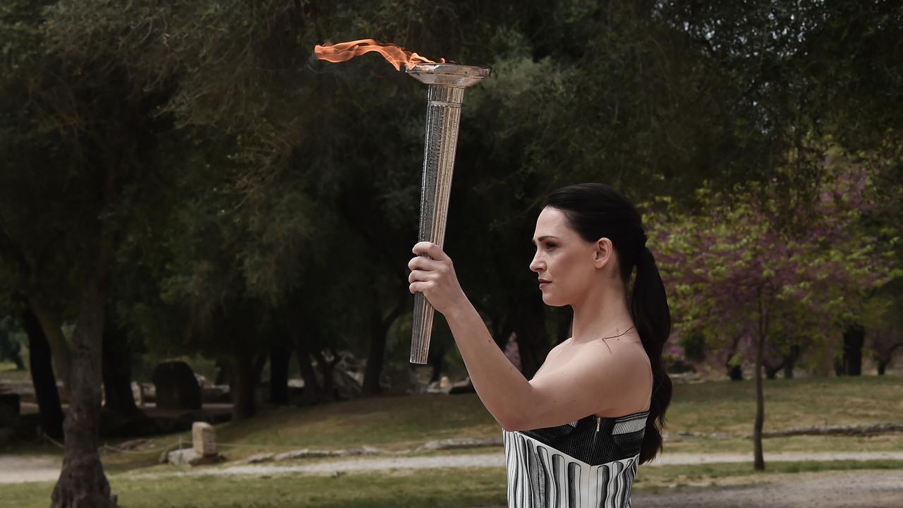 Greek actor Mary Mina carries the torch during the flame lighting ceremony for the Paris 2024 Summer Olympics at the birthplace of the ancient Olympics in southern Greece on April 16 in Olympia, Greece. Picture: Milos Bicanski/Getty Images