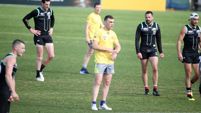 AFL umpire and former Saint Leigh Fisher (centre) was among the officials at Moorabbin for the trial. Pic: Michael Klein