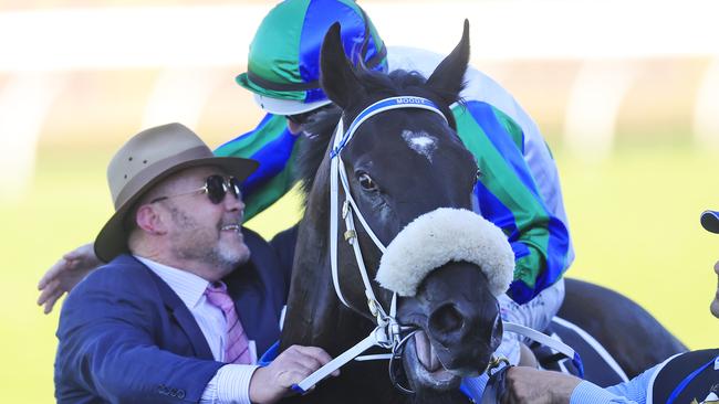 Luke Nolan on I Wish I Win greets trainer Peter Moody as he returns to scale after winning the Golden Eagle during Sydney Racing at Rosehill Gardens. (Photo by Mark Evans/Getty Images)